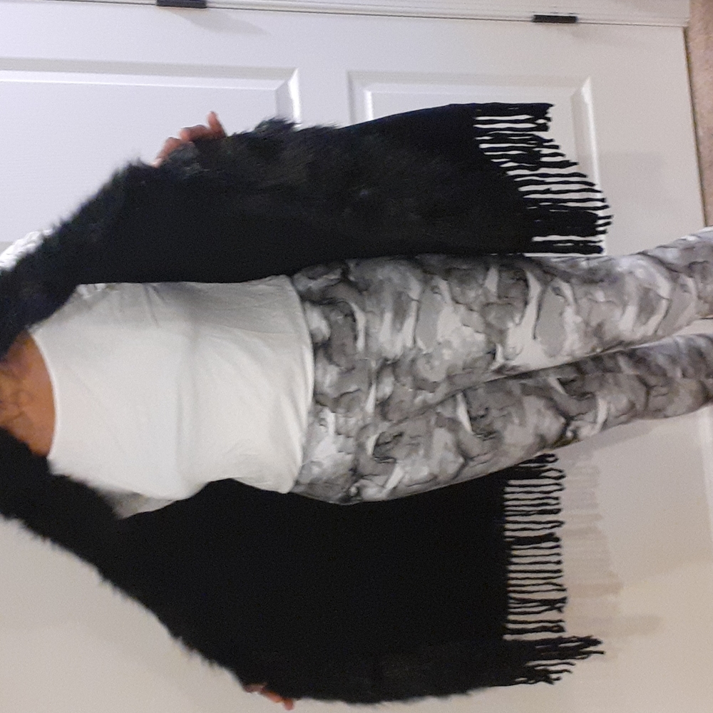 Black sweater vest with with fur. Not sure brand name, tag is missing
